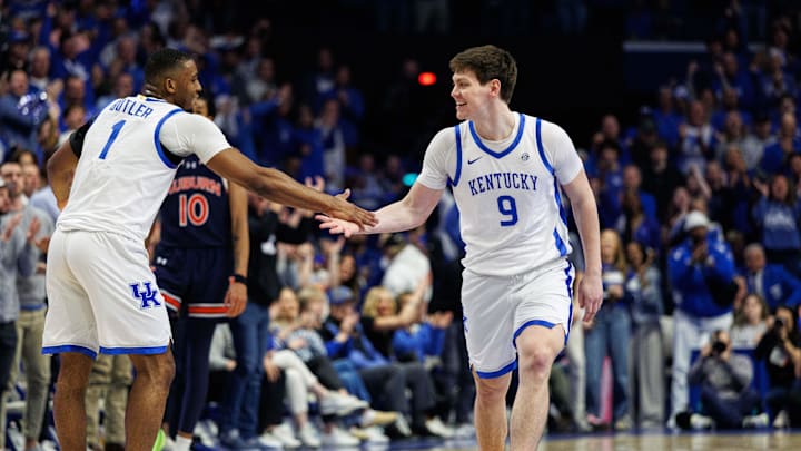 Mar 1, 2025; Lexington, Kentucky, USA; Kentucky Wildcats forward Trent Noah (9) celebrates with guard Lamont Butler (1) during the first half against the Auburn Tigers at Rupp Arena at Central Bank Center. Mandatory Credit: Jordan Prather-Imagn Images