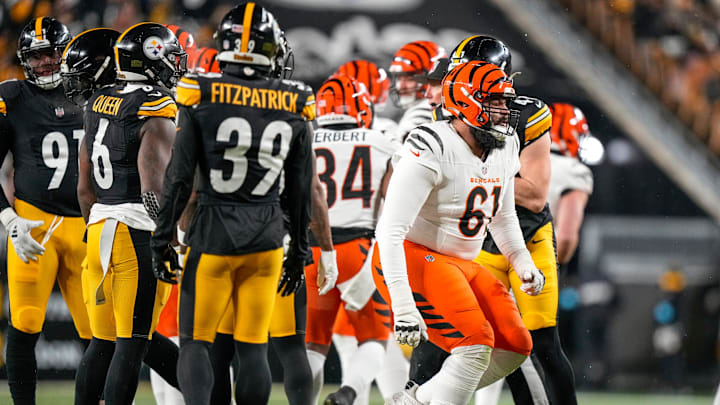 Cincinnati Bengals guard Cody Ford (61) stumbles to his feet after a pile player fall on his lower leg in the first quarter of the NFL Week 18 game between the Pittsburgh Steelers and the Cincinnati Bengals at Acrisure Stadium in Pittsburgh on Saturday, Jan. 4, 2025. Cincinnati Bengals guard Cody Ford (61) stumbles to his feet after a pile player fall on his lower leg in the first quarter of the NFL Week 18 game between the Pittsburgh Steelers and the Cincinnati Bengals at Acrisure Stadium in Pittsburgh on Saturday, Jan. 4, 2025.