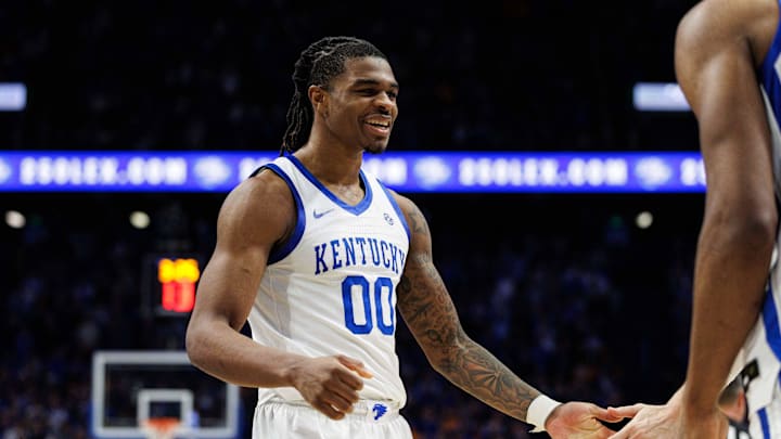 Feb 11, 2025; Lexington, Kentucky, USA; Kentucky Wildcats guard Otega Oweh (00) fives a teammate during the second half against the Tennessee Volunteers at Rupp Arena at Central Bank Center. Mandatory Credit: Jordan Prather-Imagn Images