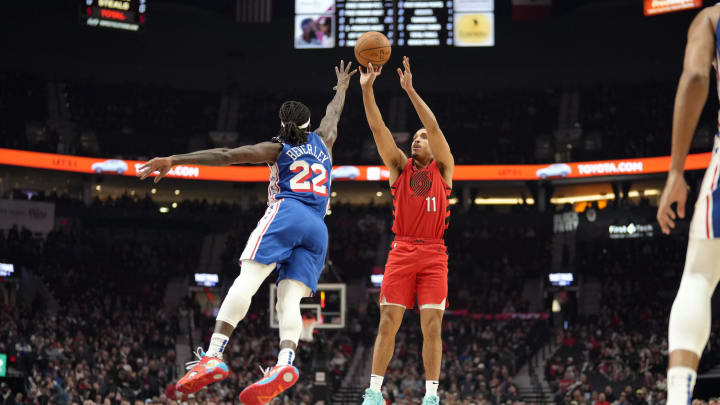 Jan 29, 2024; Portland, Oregon, USA; Portland Trail Blazers point guard Malcolm Brogdon (11) shoots the ball over Philadelphia 76ers point guard Patrick Beverley (22) during the first half at Moda Center. Mandatory Credit: Soobum Im-USA TODAY Sports