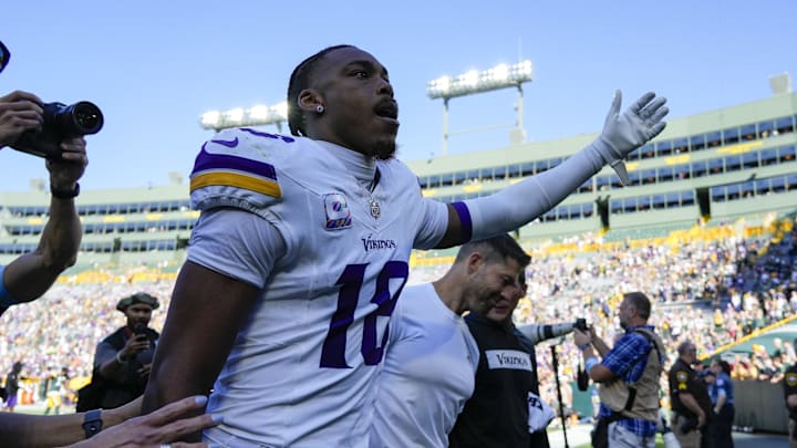 Sep 29, 2024; Green Bay, Wisconsin, USA;  Minnesota Vikings wide receiver Justin Jefferson (18) gestures to fans while leaving the field following the game against the Green Bay Packers at Lambeau Field. Mandatory Credit: Jeff Hanisch-Imagn Images