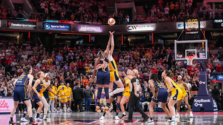 Indiana Fever forward Aliyah Boston (7) reaches for the ball against Los Angeles Sparks forward Cameron Brink (22) during tip-off Tuesday, May 28, 2024, during the game at Gainbridge Fieldhouse in Indianapolis.
