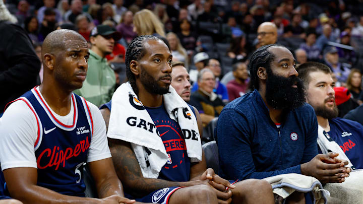 Oct 15, 2025; Sacramento, California, USA; Los Angeles Clippers guard Chris Paul (3) and forward Kawhi Leonard (2) and guard James Harden (1) sit on the bench during the fourth quarter against the Sacramento Kings at Golden 1 Center. Mandatory Credit: Sergio Estrada-Imagn Images Oct 15, 2025; Sacramento, California, USA; Los Angeles Clippers guard Chris Paul (3) and forward Kawhi Leonard (2) and guard James Harden (1) sit on the bench during the fourth quarter against the Sacramento Kings at Golden 1 Center. Mandatory Credit: Sergio Estrada-Imagn Images