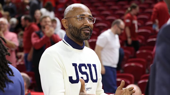 Nov 21, 2025; Fayetteville, Arkansas, USA; Jackson State Tigers head coach Mo Williams congratulates Arkansas Razorbacks players after the game at Bud Walton Arena. Arkansas won 115-61. Mandatory Credit: Nelson Chenault-Imagn Images