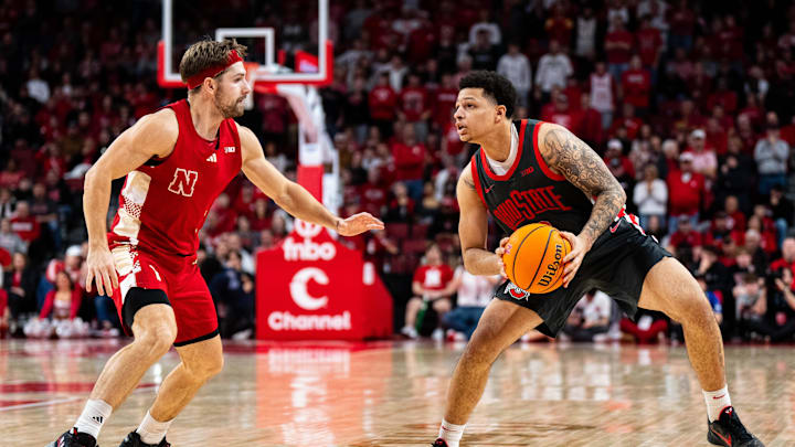 Feb 9, 2025; Lincoln, Nebraska, USA; Ohio State Buckeyes guard John Mobley Jr. (0) looks to shoot against Nebraska Cornhuskers guard Sam Hoiberg (1) during the second half at Pinnacle Bank Arena. Mandatory Credit: Dylan Widger-Imagn Images