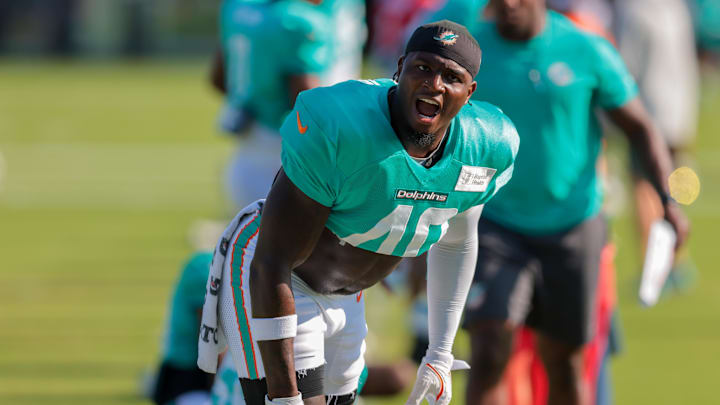 Miami Dolphins linebacker Willie Gay (40) reacts while stretching during training camp at Baptist Health Training Complex. 
