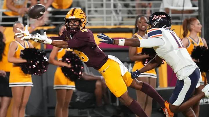 Arizona State receiver Jalen Moss (18) attempts a diving catch as Morgan State Bears defensive back Jayden Jackson (12) defends at Mountain America Stadium in Tempe on Sept 5, 2026.