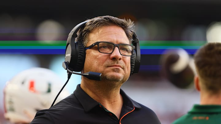 Sep 7, 2024; Miami Gardens, Florida, USA; Miami Hurricanes offensive coordinator Shannon Dawson looks on from the sideline against the Florida A&M Rattlers during the first quarter at Hard Rock Stadium. Mandatory Credit: Sam Navarro-Imagn Images Sep 7, 2024; Miami Gardens, Florida, USA; Miami Hurricanes offensive coordinator Shannon Dawson looks on from the sideline against the Florida A&M Rattlers during the first quarter at Hard Rock Stadium. Mandatory Credit: Sam Navarro-Imagn Images