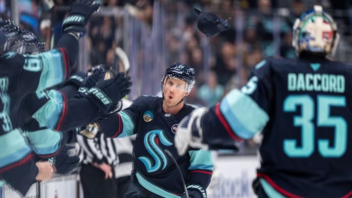 Jan 18, 2025; Seattle, Washington, USA;  Seattle Kraken forward Jaden Schwartz (17) celebrates after scoring a empty-net goal for a hat trick during the third period against the Los Angeles Kings at Climate Pledge Arena. Mandatory Credit: Stephen Brashear-Imagn Images