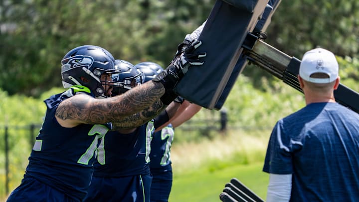 Jun 11, 2025; Renton, WA, USA; Seattle Seahawks offensive linemen, including Abraham Lucas (72) take part in drills during mini-camp at Virginia Mason Athletic Center.