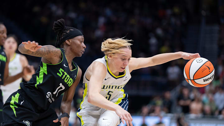 Dallas Wings guard Paige Bueckers dribbles the ball against Seattle Storm guard Erica Wheeler. Dallas Wings guard Paige Bueckers dribbles the ball against Seattle Storm guard Erica Wheeler.