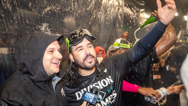 Sep 24, 2025; Seattle, Washington, USA; Seattle Mariners third baseman Eugenio Suarez (28), right, celebrates in the clubhouse after winning the American League West Division in a game against the Colorado Rockies  at T-Mobile Park. Mandatory Credit: Stephen Brashear-Imagn Images
