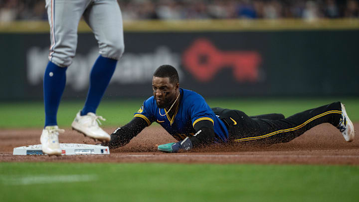 Seattle Mariners left fielder Victor Robles (10) slides safely into third base during the first inning against the Texas Rangers at T-Mobile Park on Sept 13. Seattle Mariners left fielder Victor Robles (10) slides safely into third base during the first inning against the Texas Rangers at T-Mobile Park on Sept 13.