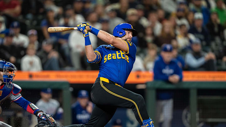 Seattle Mariners catcher Cal Raleigh (29) takes a swing during an at-bat against the Texas Rangers at T-Mobile Park in 2024.