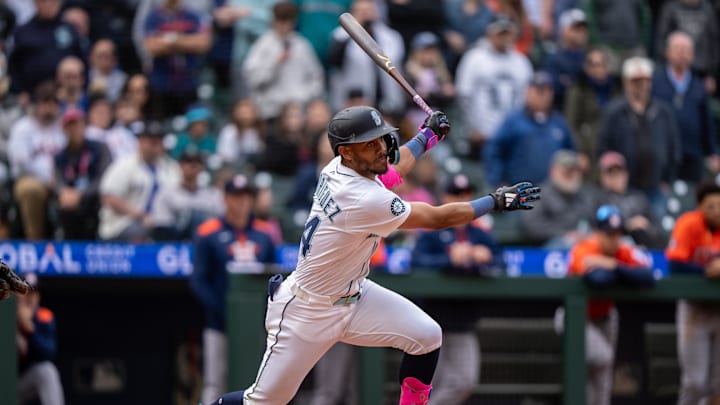 Seattle Mariners centerfielder Julio Rodriguez (44) hits a two-run double during the ninth inning against the Houston Astros at T-Mobile Park on April 9.