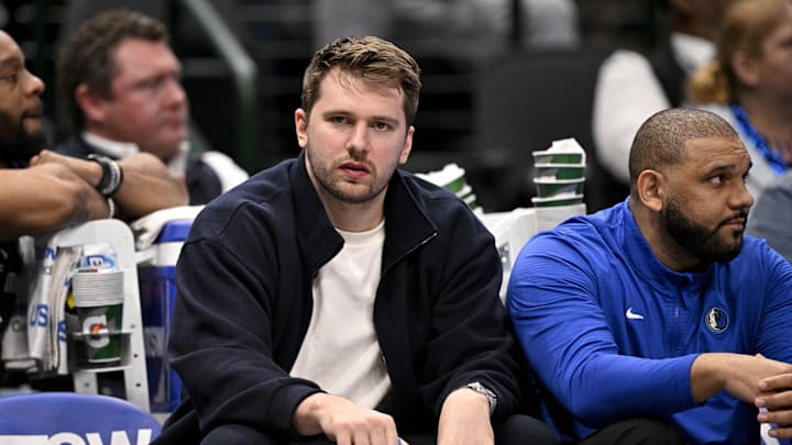 Jan 12, 2025; Dallas, Texas, USA; Dallas Mavericks guard Luka Doncic (77) reacts from the team bench during the second half of the game against the Denver Nuggets at the American Airlines Center. Mandatory Credit: Jerome Miron-Imagn Images