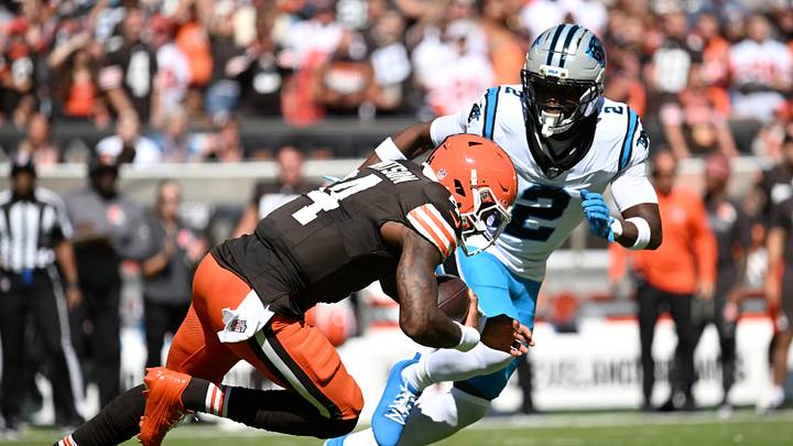 Cleveland Browns quarterback Deshaun Watson (4) scrambles with the ball defended by Carolina Panthers cornerback Mike Jackson