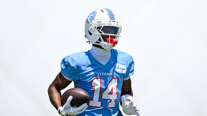 Jun 16, 2026; Nashville, TN, USA;  Tennessee Titans wider receiver Carnell Tate (14) runs with the ball after a made catch during day 1 of mini-camp at Vanderbilt Health Football Center. Mandatory Credit: Steve Roberts-Imagn Images