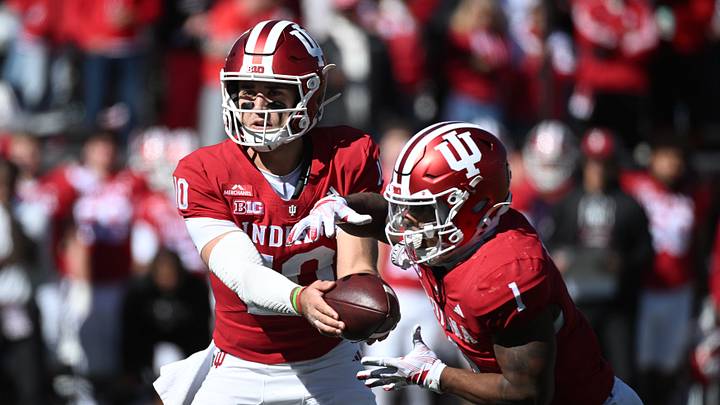 Oct 17, 2026; Bloomington, Indiana, USA; Indiana Hoosiers quarterback Josh Hoover (10) hands off to\ running back Turbo Richard (1) during the first half against the Ohio State Buckeyes at Merchants Bank Field at Memorial Stadium. Mandatory Credit: Robert Goddin-Imagn Images Oct 17, 2026; Bloomington, Indiana, USA; Indiana Hoosiers quarterback Josh Hoover (10) hands off to\ running back Turbo Richard (1) during the first half against the Ohio State Buckeyes at Merchants Bank Field at Memorial Stadium. Mandatory Credit: Robert Goddin-Imagn Images