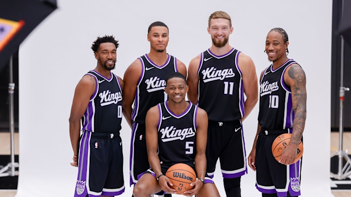 Sep 30, 2024; Sacramento, CA, USA; Sacramento Kings guard Malik Monk (0) and forward Keegan Murray (13) and forward Domantas Sabonis (11) and forward DeMar DeRozan (10) and guard De'Aaron Fox (5) pose for a photo during media day at Golden 1 Center. Mandatory Credit: Sergio Estrada-Imagn Images