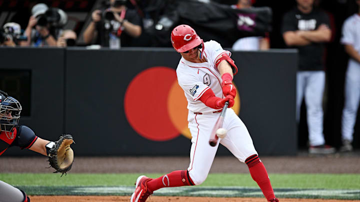 Aug 3, 2025; Bristol, Tennessee, USA; Cincinnati Reds second base Matt McLain (9) hits a sacrifice fly during the fourth inning against the Atlanta Braves at Bristol Motor Speedway. Mandatory Credit: Bryan Lynn-Imagn Images