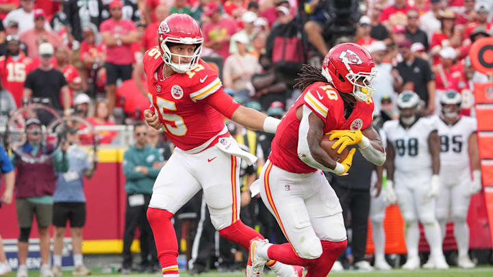 Sep 14, 2025; Kansas City, Missouri, USA; Kansas City Chiefs quarterback Patrick Mahomes (15) hands off to running back Isiah Pacheco (10) against the Philadelphia Eagles during the game at GEHA Field at Arrowhead Stadium. Mandatory Credit: Denny Medley-Imagn Images