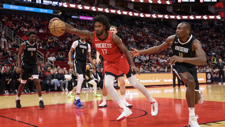 Dec 13, 2023; Houston, Texas, USA; Houston Rockets forward Tari Eason (17) grabs a rebound against Memphis Grizzlies center Bismack Biyombo (18) in the second half at Toyota Center. Mandatory Credit: Thomas Shea-USA TODAY Sports Dec 13, 2023; Houston, Texas, USA; Houston Rockets forward Tari Eason (17) grabs a rebound against Memphis Grizzlies center Bismack Biyombo (18) in the second half at Toyota Center. Mandatory Credit: Thomas Shea-USA TODAY Sports