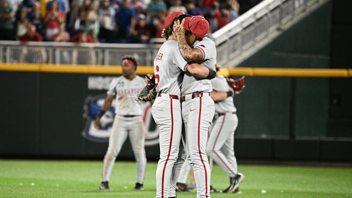 Jun 18, 2025; Omaha, Neb, USA;  Arkansas Razorbacks infielder Gabe Fraser (6) consoles shortstop Wehiwa Aloy (9) after the loss against the LSU Tigers at Charles Schwab Field. Mandatory Credit: Steven Branscombe-Imagn Images