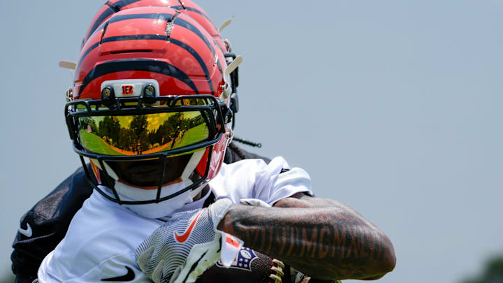 Cincinnati Bengals wide receiver Ja'Marr Chase (1) pulls in a catch during a session of organized team activities on the Bengals practice field at Paycor Stadium in downtown Cincinnati on Tuesday, June 3, 2025.