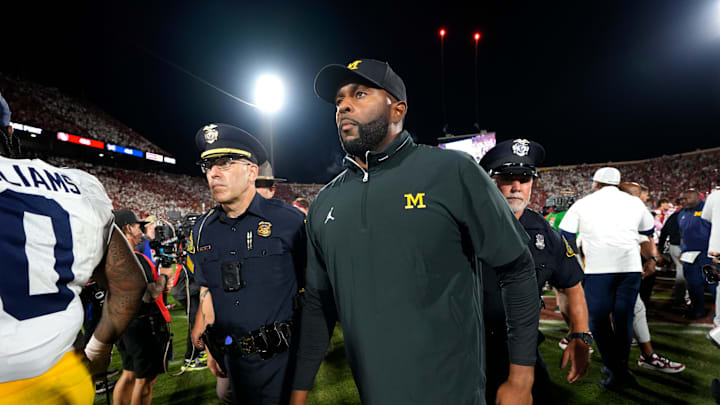 Michigan coach Sherrone Moore leaves the field after a college football game between the University of Oklahoma Sooners (OU) and the University of Michigan Wolverines at Gaylord Family Ð Oklahoma Memorial Stadium in Norman, Okla., Saturday, Sept. 6, 2025. Oklahoma won 24-13.