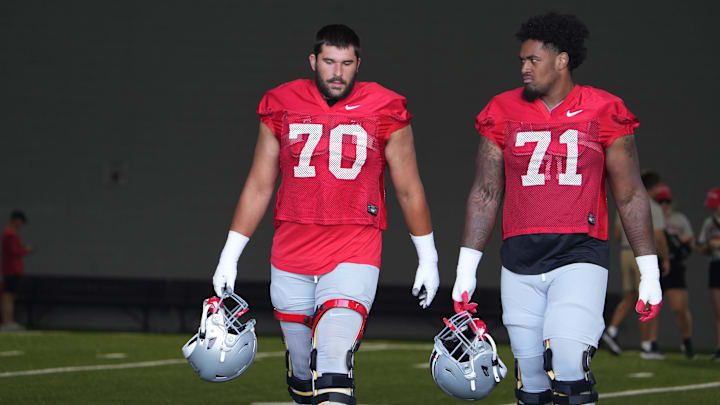 Aug 3, 2023; Columbus, OH, USA; Josh Fryar (left) and Josh Simmons walk on the field befofre the