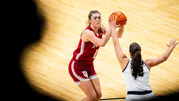 Indiana Hoosiers forward Karoline Striplin (11) goes up for a shot againstButler Bulldogs forward Sydney Jaynes (32) on Wednesday, Nov. 13, 2024, during a women’s basketball game between the Butler Bulldogs and the Indiana Hoosiers at Hinkle Fieldhouse in Indianapolis. The Bulldogs defeated the Hoosiers, 56-46.