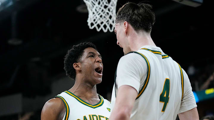 Wright State Raiders guard Solomon Callaghan (13) yells with Wright State Raiders forward Kellen Pickett (4).