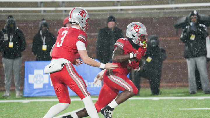 Baylor's Briggs Cherry (3) hands the ball of to Baylor's David Gabriel Georges (0) during the Division II-AAA Championship match between Baylor versus. Brentwood Academy in Finley Stadium, Chattanooga, Tenn., on Thursday, Dec. 4, 2025. Baylor's Briggs Cherry (3) hands the ball of to Baylor's David Gabriel Georges (0) during the Division II-AAA Championship match between Baylor versus. Brentwood Academy in Finley Stadium, Chattanooga, Tenn., on Thursday, Dec. 4, 2025.