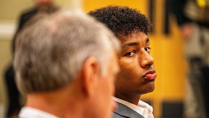 Ole Miss quarterback Trinidad Chambliss glances over toward members of the press during the hearing of his lawsuit against the NCAA at Calhoun County Courthouse in Pittsboro, Miss., on Thursday, Feb. 12, 2026. Chambliss is looking for a temporary injunction and a permanent injunction against the NCAA for one more year of eligibility.
