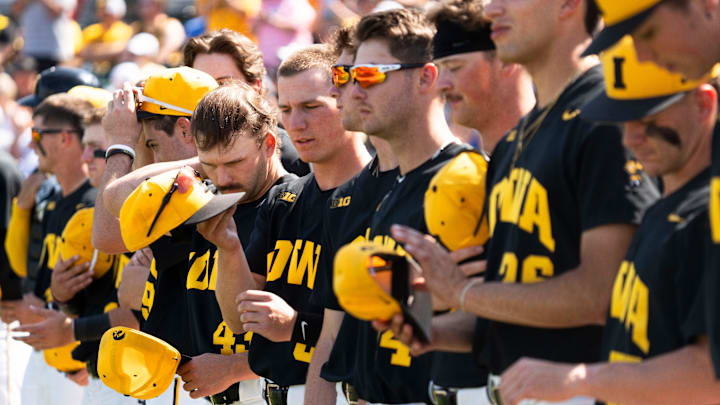 Players line up for the national anthem during game 2 of Iowa vs. Oregon State baseball at Principal Park on May 10, 2025, in Des Moines.