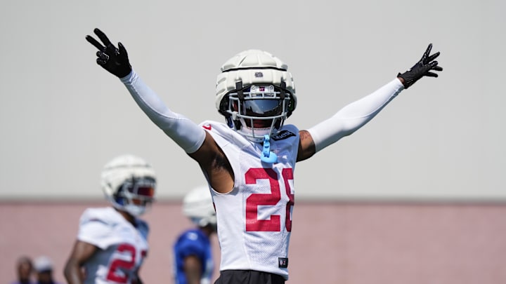 Jul 26, 2024; East Rutherford, NJ, USA; New York Giants cornerback Cordale Flott (28) reacts during training camp at Quest Diagnostics Training Center. Mandatory Credit: Lucas Boland-Imagn Images