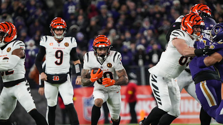 Bengals Chase Brown (30) takes the ball down the field during their game against the Ravens at M&T Bank Stadium on Thanksgiving Thursday November 27, 2025.