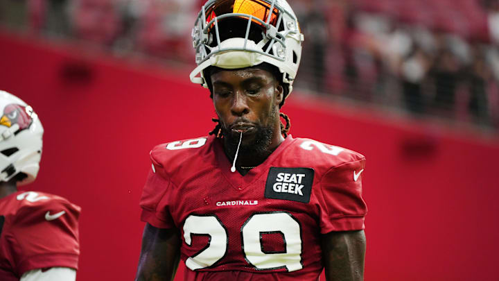 Running back Jonathan Ward spits as he walks off the field during the Arizona Cardinals Back