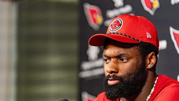 Josh Sweat speaks to members of the media at the Arizona Cardinals Training Center in Tempe