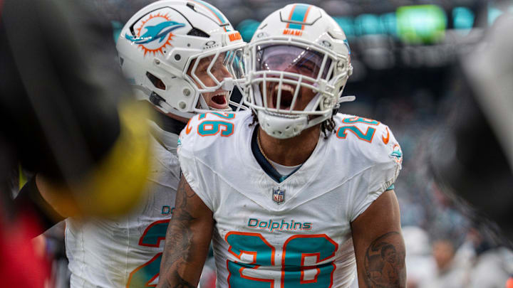 Miami Dolphins defensive back Rasul Douglas (26) celebrates after intercepting a pass during a week 14 football game between the New York Jets and Miami Dolphins at MetLife Stadium.