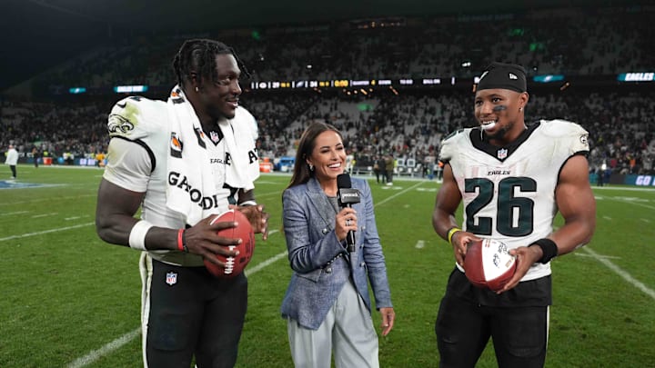 Sep 6, 2024; Sao Paulo, Brazil; Peacock sideline reporter Kaylee Hartung (center) interviews Philadelphia Eagles wide receiver A.J. Brown (11) and running back Saquon Barkley (26) after the 2024 NFL Sao Paolo Game at Neo Quimica Arena.
