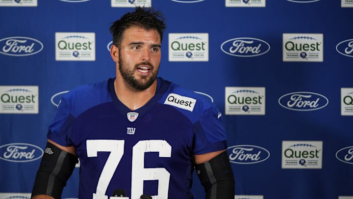 New York Giants offensive guard Jon Runyan (76) speaks at a press conference after training camp at Quest Diagnostics Training Center. 