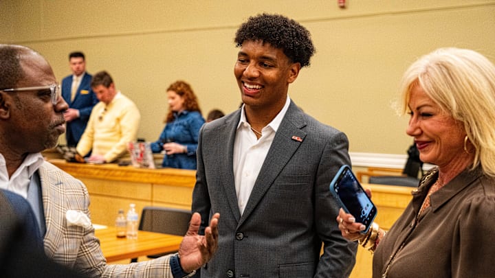 Ole Miss quarterback Trinidad Chambliss talks with supporters after the hearing of Chambliss in his lawsuit against the NCAA at Calhoun County Courthouse in Pittsboro, Miss., on Thursday, Feb. 12, 2026. Chambliss was granted a preliminary injunction against the NCAA.