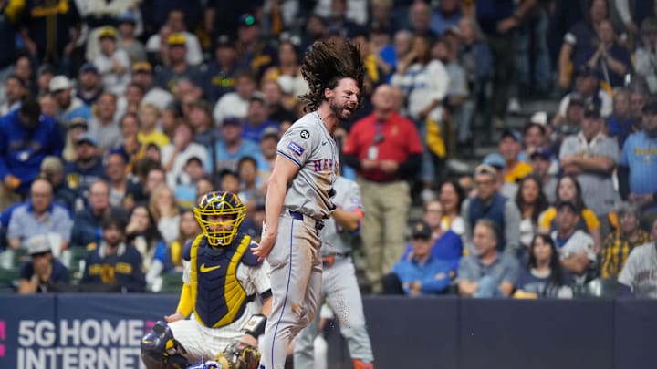 New York Mets right fielder Starling Marte (6) singles on a sharp ground ball to Milwaukee Brewers right fielder Sal Frelick (10) allowing New York Mets designated hitter Jesse Winker (3) to score during the ninth inning in Game 3 of National League wild-card series on Thursday October 3, 2024 at American Family Field in Milwaukee, Wis.