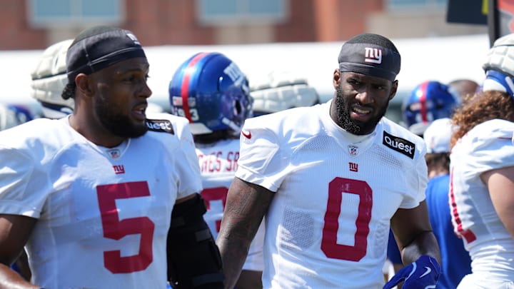 Jul 26, 2024; East Rutherford, NJ, USA; New York Giants linebacker Kayvon Thibodeaux (5) and New York Giants linebacker Brian Burns (0) break on the sideline during training camp at Quest Diagnostics Training Center.  