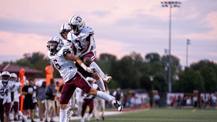 No. 9 Dowling's Jack Barrett (6) celebrates with Sam Drexler (3) after a big gain and a first down Friday, Sept. 13, 2024, at Ankeny Stadium.