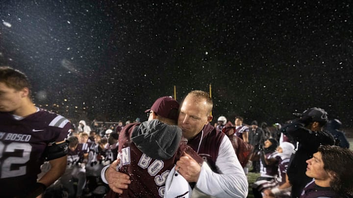 Nov 22, 2024; Ramsey, NJ, USA; St. Augustine Prep at Don Bosco Prep in the NJSIAA Non-Public A football semifinals. Don Bosco head coach Dan Sabella and his team celebrate defeating St. Augustine.