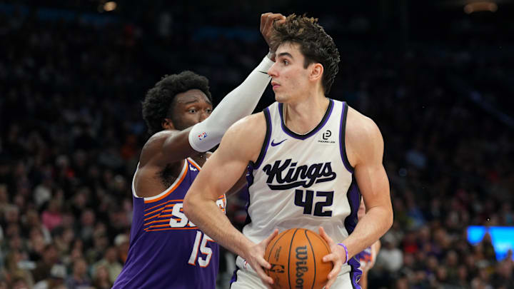 Jan 2, 2026; Phoenix, Arizona, USA; Sacramento Kings center Maxime Raynaud (42) posts up against Phoenix Suns center Mark Williams (15) during the second half at Mortgage Matchup Center. Mandatory Credit: Joe Camporeale-Imagn Images