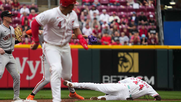 Reds Elly De La Cruz (44) slides into second base but is out during their game against the San Francisco Giants at Great American Ball Park on Sunday March 30, 2025. The San Francisco Giants won the game with a final score of 6-3. Reds Elly De La Cruz (44) slides into second base but is out during their game against the San Francisco Giants at Great American Ball Park on Sunday March 30, 2025. The San Francisco Giants won the game with a final score of 6-3.